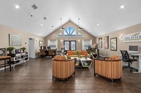 Winter Park apartment for rent - the lobby of a clubhouse with couches and chairs at Oak Reserve at Winter Park, Winter Park