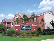 Stillwater apartment for rent - a building with a sign in front of it at Chapel Ridge of Stillwater, Stillwater, Oklahoma