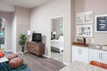 Hopkins apartment for rent - A living room with a white couch and a television.
