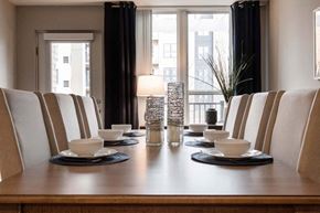 Brooklyn Park apartment for rent - a wooden table with white cups and saucers on it