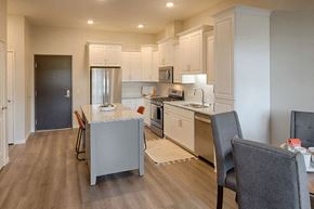 Edina apartment for rent - a kitchen and dining room with a table and chairs