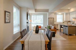 Edina apartment for rent - a dining room table with a vase on top of it