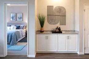 Edina apartment for rent - a bedroom with a bed and a sink in a room