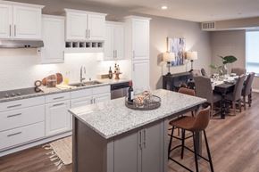 Maple Grove apartment for rent - a kitchen with an island and a dining room in the background