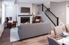 Maple Grove apartment for rent - a living room with a couch and chairs in front of a fireplace