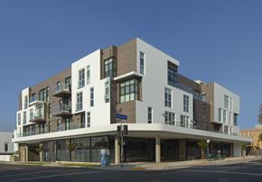 Los Angeles apartment for rent - A modern multi-story building with a mix of white and brown exterior.