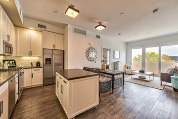 Los Angeles apartment for rent - A modern kitchen with a large island in the middle.