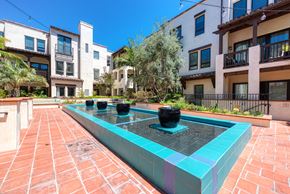 Los Angeles apartment for rent - A fountain in the middle of a courtyard surrounded by buildings.
