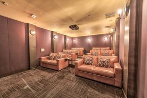 Los Angeles apartment for rent - A room with pink couches and a carpeted floor.
