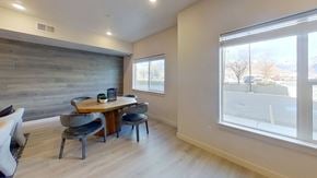 Ogden apartment for rent - a dining room with a table and chairs and a large window