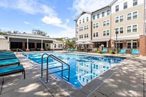 Newberry apartment for rent - Resort-style pool and lounge area at The Flats at Tioga Town Center apartments in Newberry, FL.