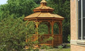 Exton apartment for rent - A wooden gazebo with a brown roof is surrounded by greenery.
