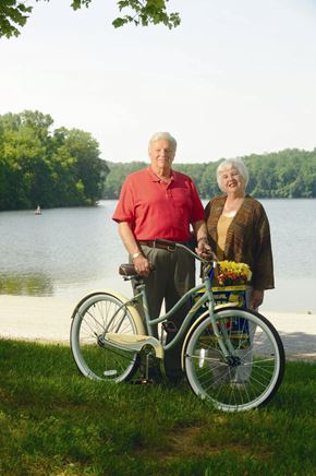 Exton apartment for rent - An elderly couple standing next to a green bicycle.