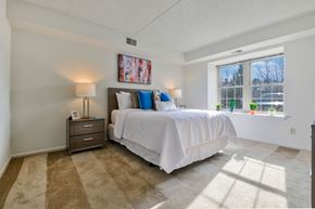 Exton apartment for rent - A bedroom with carpet flooring and a large window providing ample natural light.