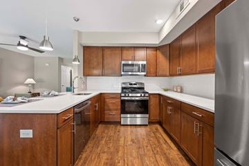 Exton apartment for rent - A modern kitchen with wooden cabinets and stainless steel appliances.