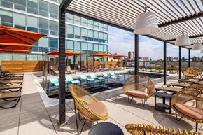 St. Louis apartment for rent - A rooftop patio with a pool and chairs. at One Foundry Way Apartments, St Louis