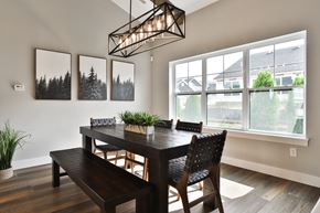 St. Peters townhouse for rent - a dining room with a table and chairs and a large window