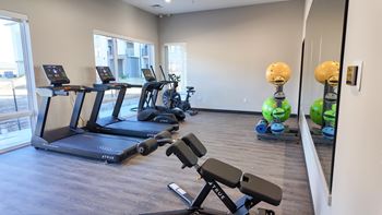 24-Hour fitness center with cardio and free weights