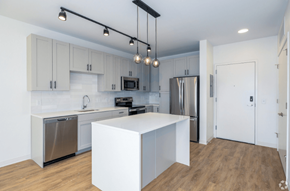St Louis apartment for rent - a kitchen with white cabinets and stainless steel appliances  at 2200 LaSalle, St Louis