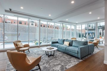 St Louis apartment for rent - a living room with a couch and chairs and large windows
