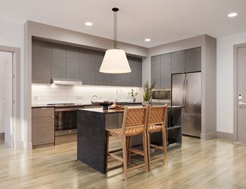 Modern kitchen with dark wood cabinets and island seating