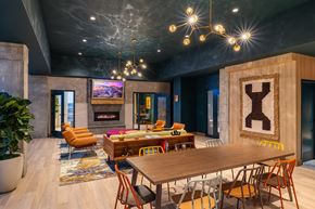 St. Louis apartment for rent - A modern dining room with a wooden table and chairs.
