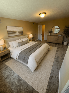 Mt. Vernon apartment for rent - A bedroom with a large bed and a painting on the wall.