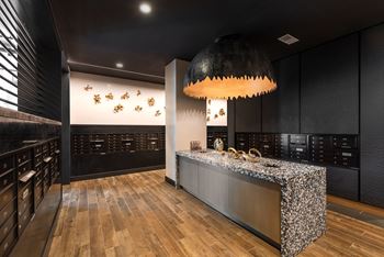 Mailroom with terrazzo counter and decorative pendant light