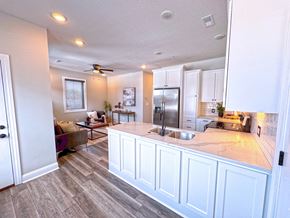 Sedalia apartment for rent - A kitchen with a countertop and a refrigerator.