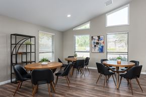 Lake St Louis apartment for rent - a dining room with tables and chairs and windows