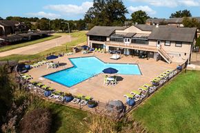 Lake St Louis apartment for rent - arial view of a pool with a house in the background