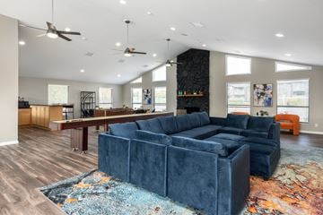 Lake St Louis apartment for rent - a living room with a blue couch and a pool table