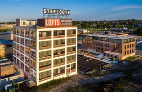 St Louis apartment for rent - an aerial view of a building with a sign on top of it