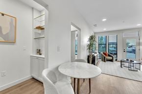 Rogers apartment for rent - Open floor plan with dining area and living space at Plaza at Pinnacle Hills Apartments, Rogers, 72758
