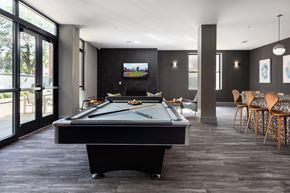 St Louis apartment for rent - Hibernia resident lounge with pool table, large TV, and built-in fireplace at Hibernia Apartments, St Louis