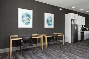 St Louis apartment for rent - a dining room with a table and chairs and two paintings on the wall at Hibernia Apartments, St Louis, MO