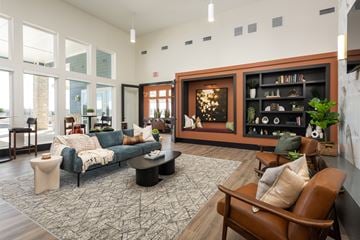 Lake St. Louis townhouse for rent - A living room with a blue couch and a brown chair.