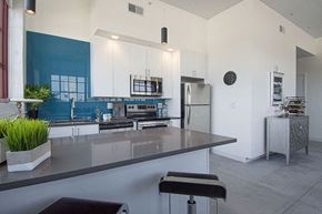 St Louis apartment for rent - a kitchen with a counter top and a refrigerator