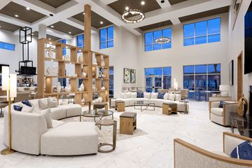 Shiloh apartment for rent - a living room with couches and tables in a furniture store