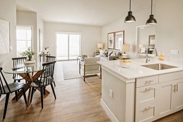 Valley Park apartment for rent - an open kitchen and living room with a dining room table and chairs