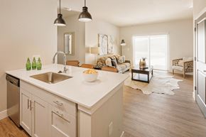Valley Park apartment for rent - an open floor plan with a kitchen and living room at 44 West Luxury Living, Valley Park, MO