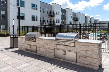Outdoor grilling stations with built in barbecues