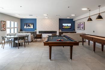 Game room with billiards and dining area