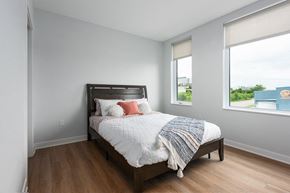 St. Louis apartment for rent - bedroom with plank flooring and large windows at Steelcote Square, St. Louis, 63103