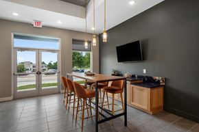 Olivette apartment for rent - A modern dining room with a wooden table and chairs at The Oliver Apartments, Olivette