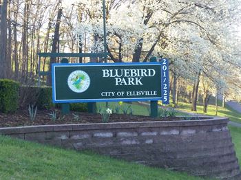 Property entrance sign with landscaping