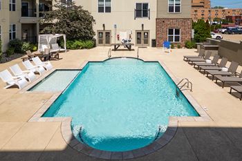 Spacious sundeck with cabanas and lounge chairs