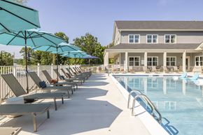 Osage Beach apartment for rent - A pool area with sun loungers and umbrellas.at Preserve at Sycamore Creek, Missouri 65065