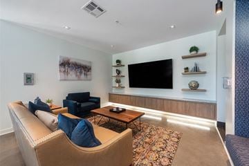 St. Louis apartment for rent - a living room with a couch and a television