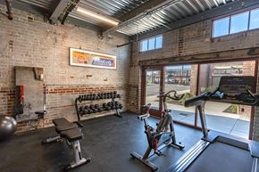 St Louis apartment for rent - the gym has plenty of equipment and a window to the street
